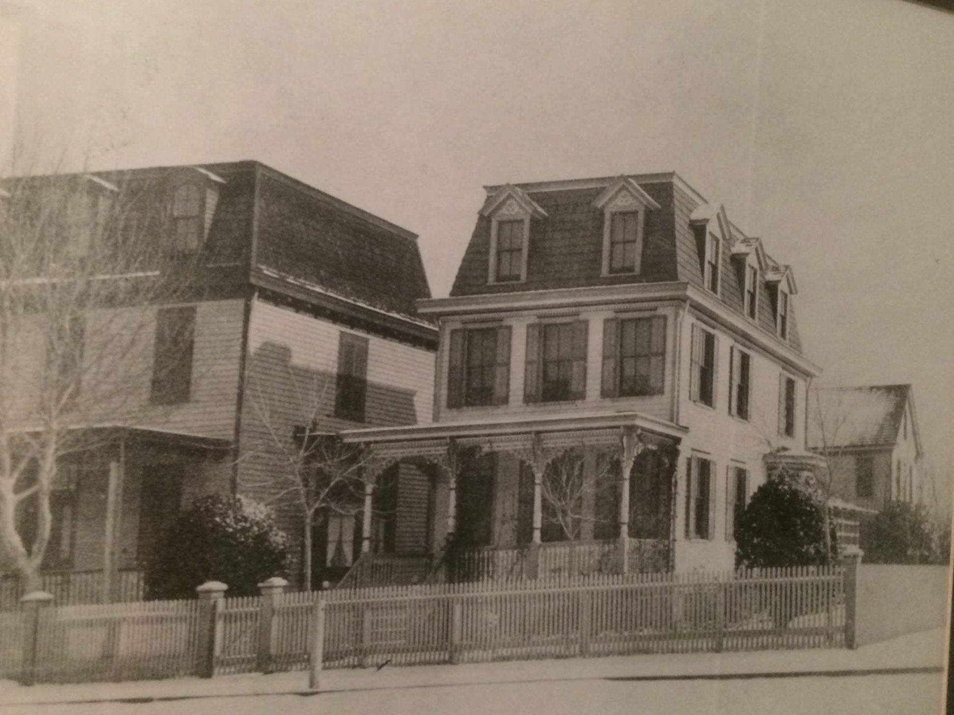 Black and white image of the front of 301, circa 1900. 295 visible in background.